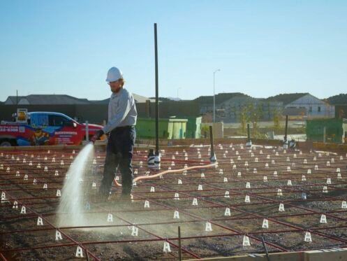 A worker sprays water